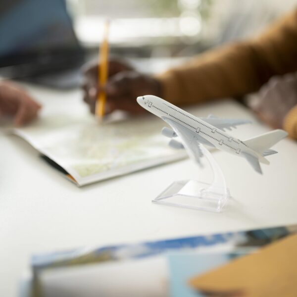 close-up-blurry-hand-holding-pencil-min